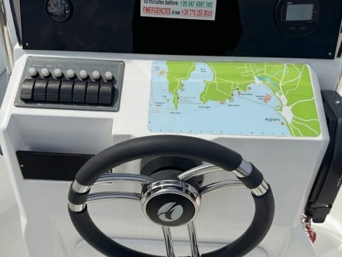 Map of the Alghero coast on the console of the Idea 53 rental boat