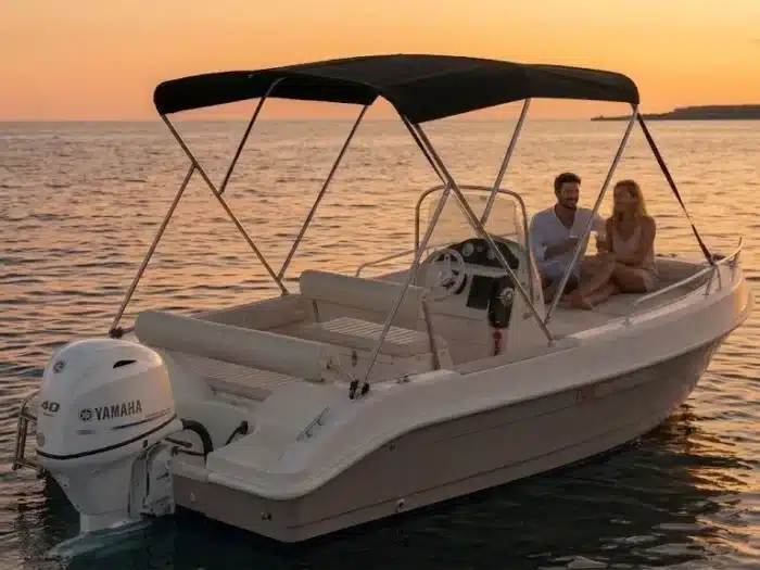 Couple on a boat at sunset, Alghero rental, no license required