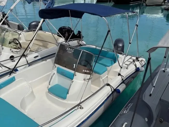 Rental boat moored at Porto Conte for boat rental Alghero