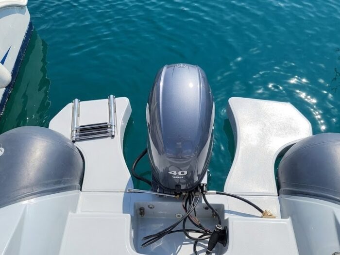 Detail of the stern platforms and boarding ladder on the Alghero rental RIB